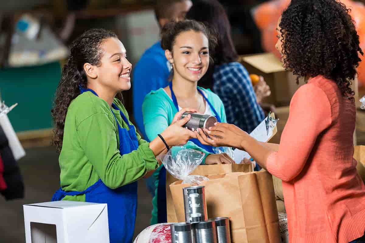 Woman donates canned goods to charity